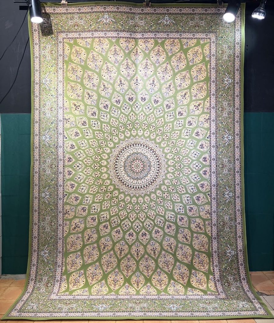 Machine-made carpet, sage green field with radiating fanlight medallion pattern